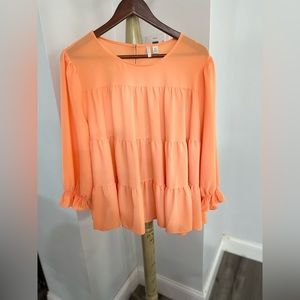 Orange blouse.
